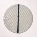 Solid sage green reverse side of the playmat laid flat, featuring a thick black fabric strap running across the center.