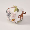 Angled view of the MiniDream sensory learning toy displaying the monkey design along with soft, crinkly jungle leaves for tactile exploration.