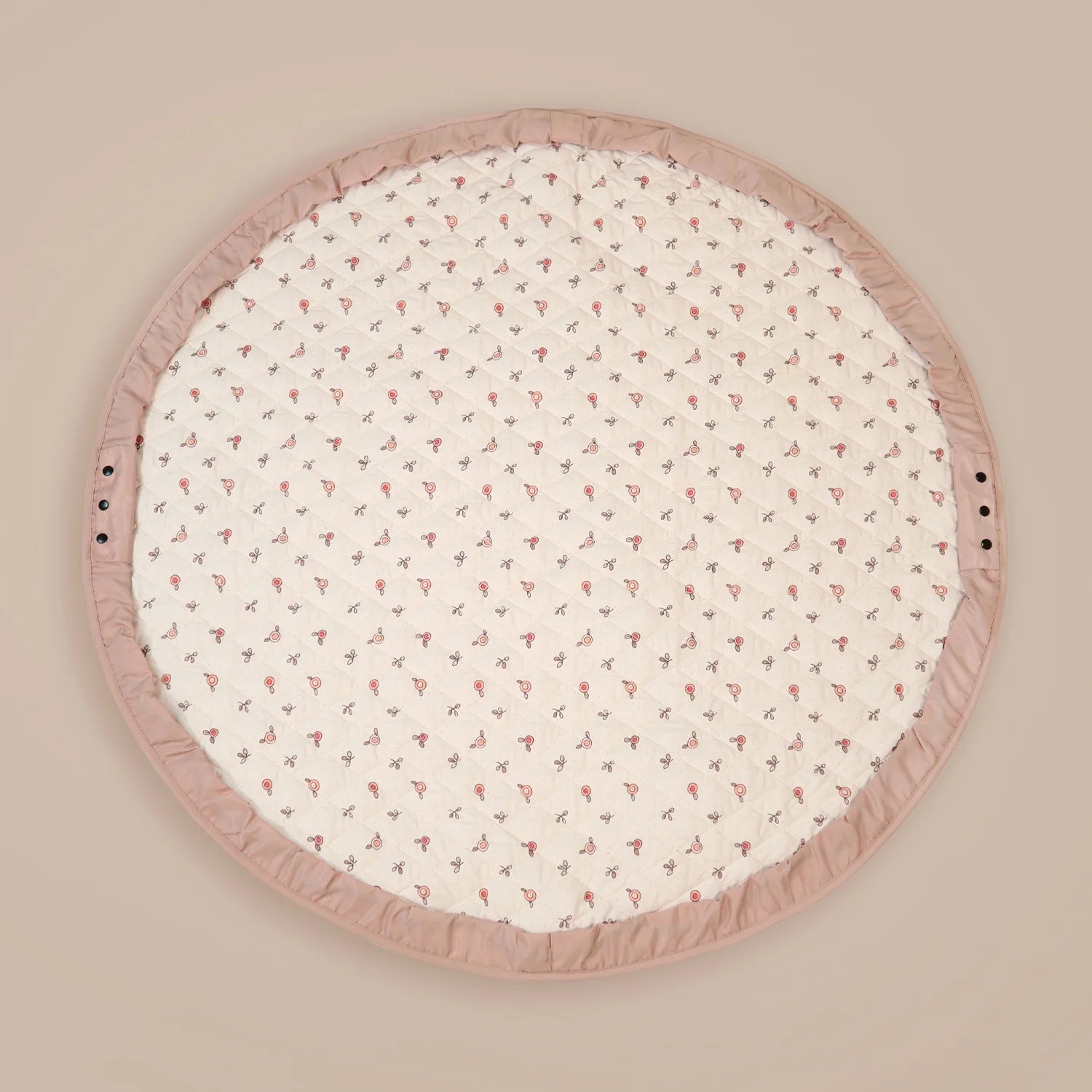 MiniDream 2-in-1 baby pink playmat laid flat, featuring a cream patterned interior and a solid pink border.
