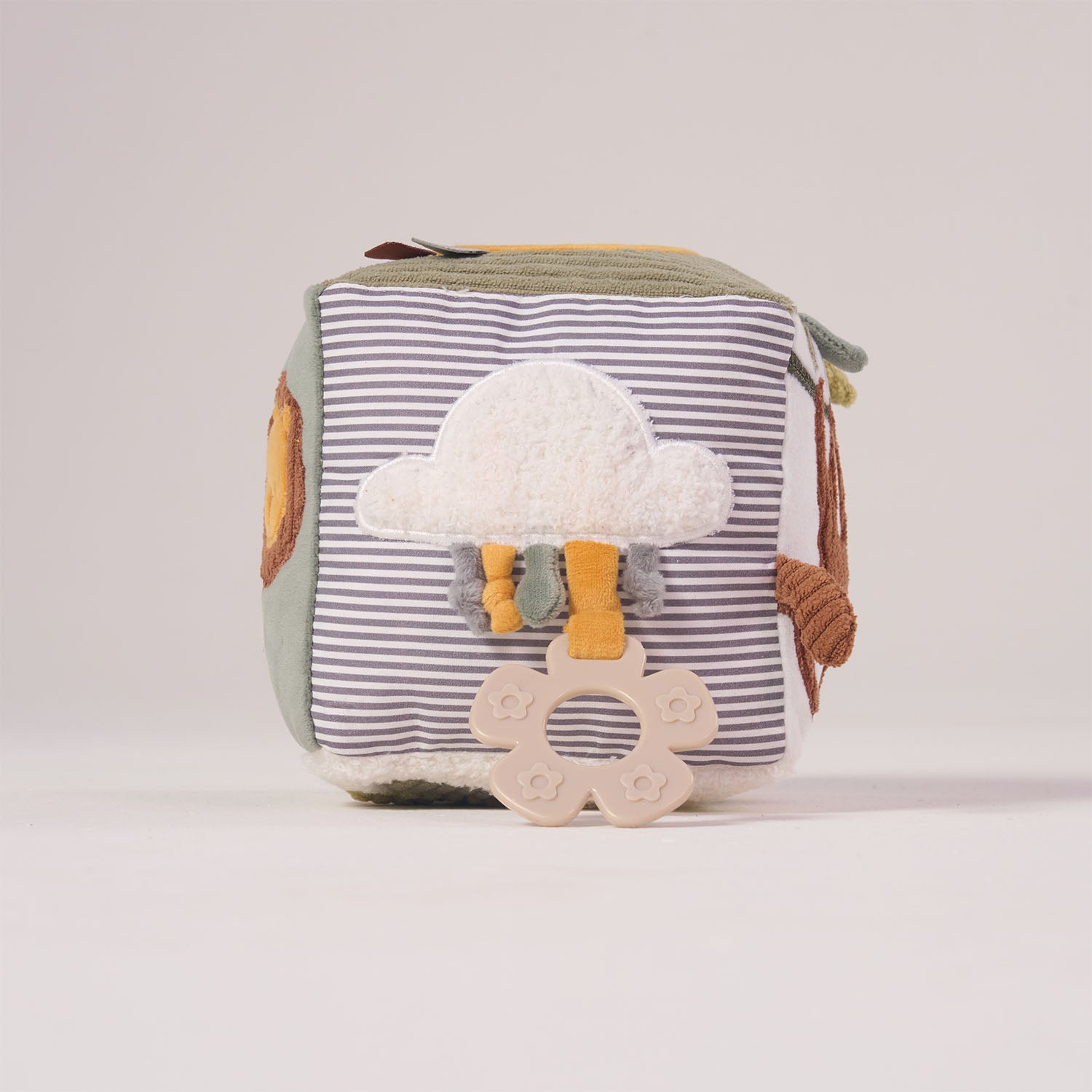 Side view of the MiniDream baby activity cube highlighting a soft sensory cloud applique with hanging textured knots.