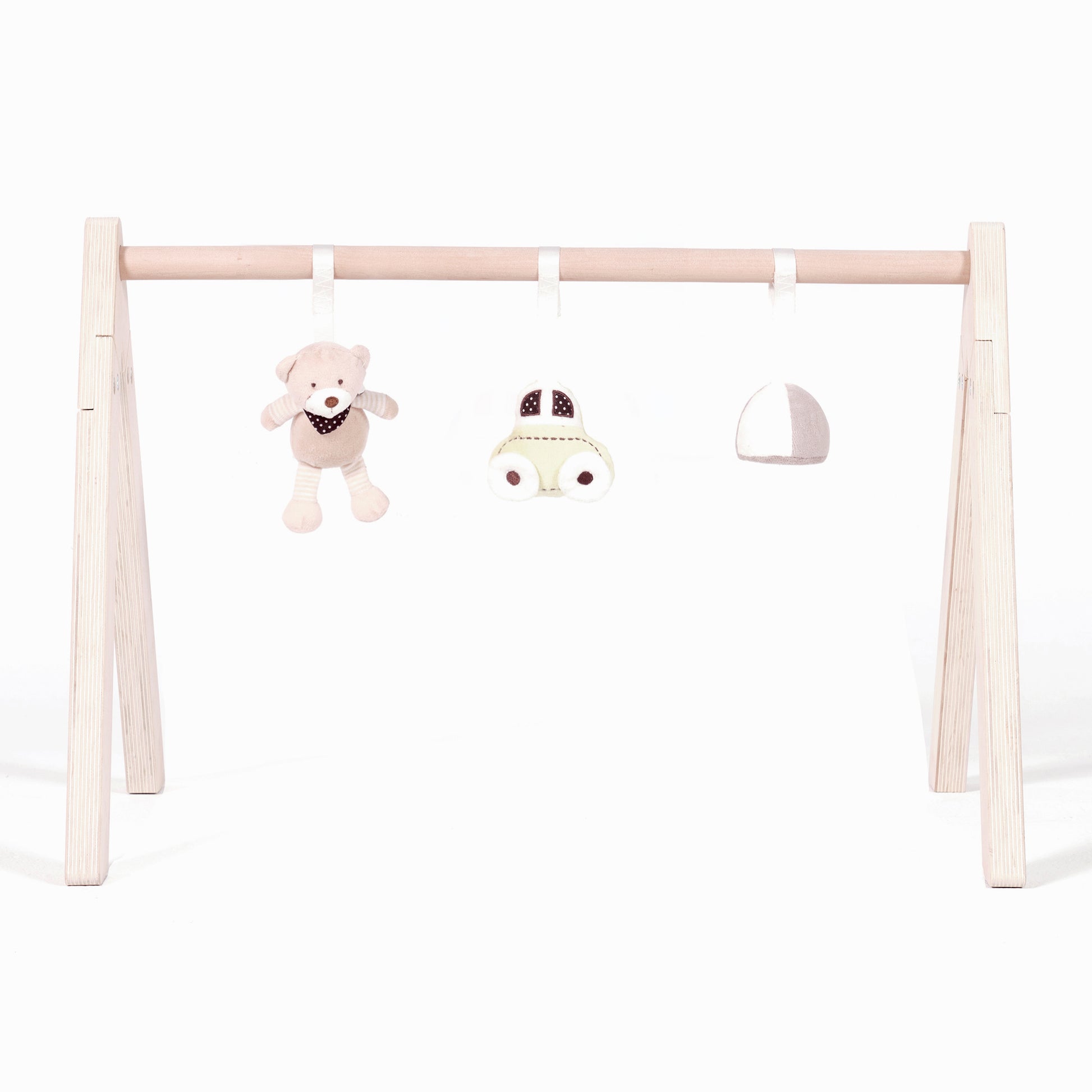 Wooden play gym with toys in a white background.