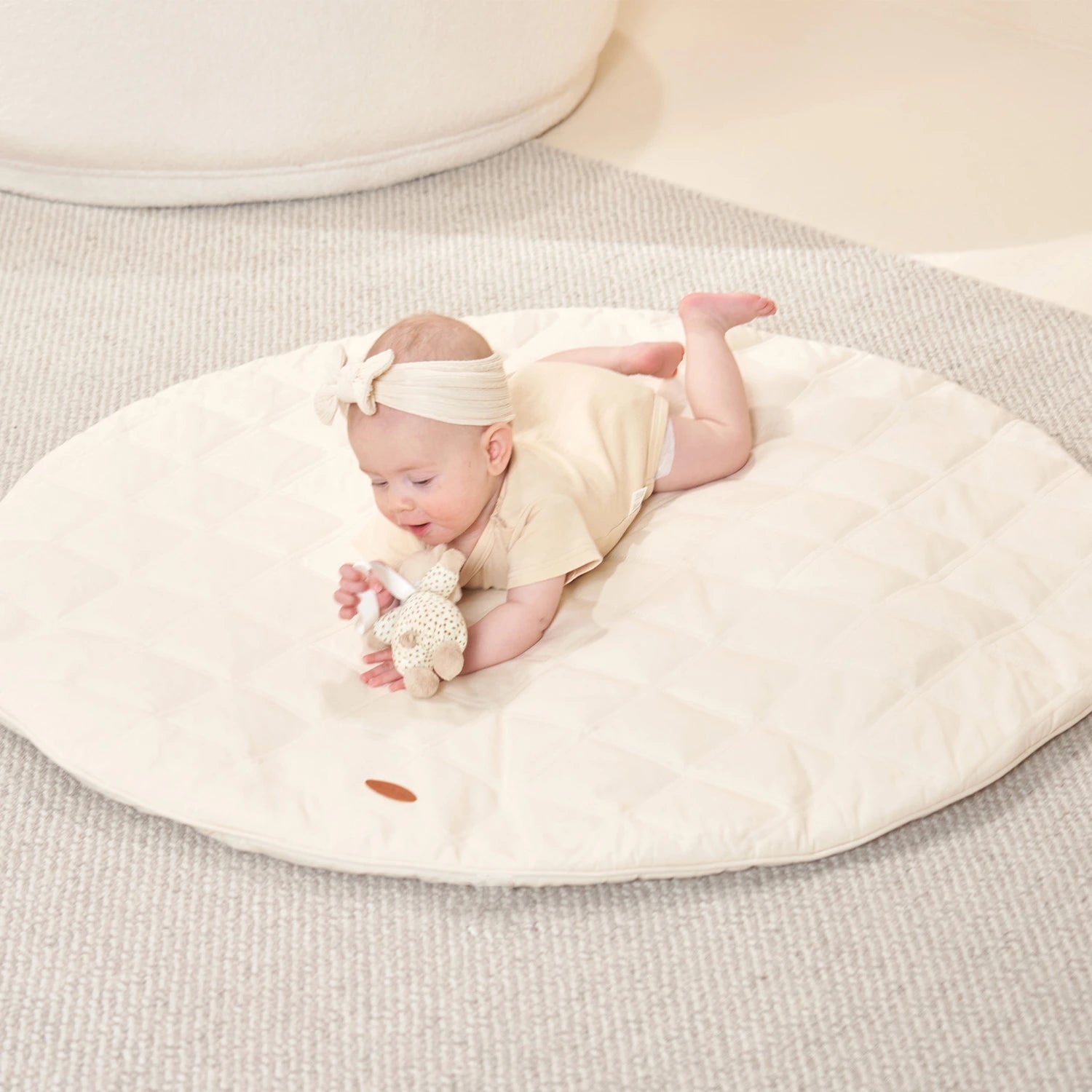 Neutral cream-colored Round Play Mat.