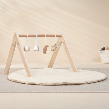 Close-up of Wooden Play Gym’s hanging sensory toys.